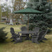 Dark grey Royal Picnic Set for 6 under a green umbrella in a garden setting.