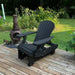 Royal Reclining Glider on a wooden deck with a garden background - poly luxe - black
