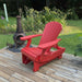 Royal Reclining Glider on a wooden deck with a garden background - poly luxe - red