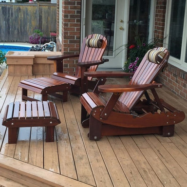 Royal Reclining Glider in Mahogany Glossy trim, on a wooden deck with a pool in the background.