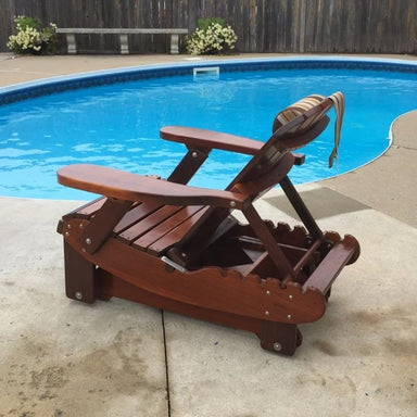 Royal Reclining Glider by a pool with flowers in the background