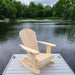 Royal Rocking Adirondack Chair (Large)  on a dock by a lake with trees in the background