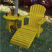 Yellow Royal Single Patio Set on a grassy area with trees and plants in the background.