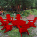 red Adirondack chair set with coffee table