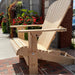 Traditional Giant chair on a patio with flowers and a building in the background