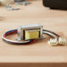 Transformer For Platinum & Tungsten Gas on a wooden surface